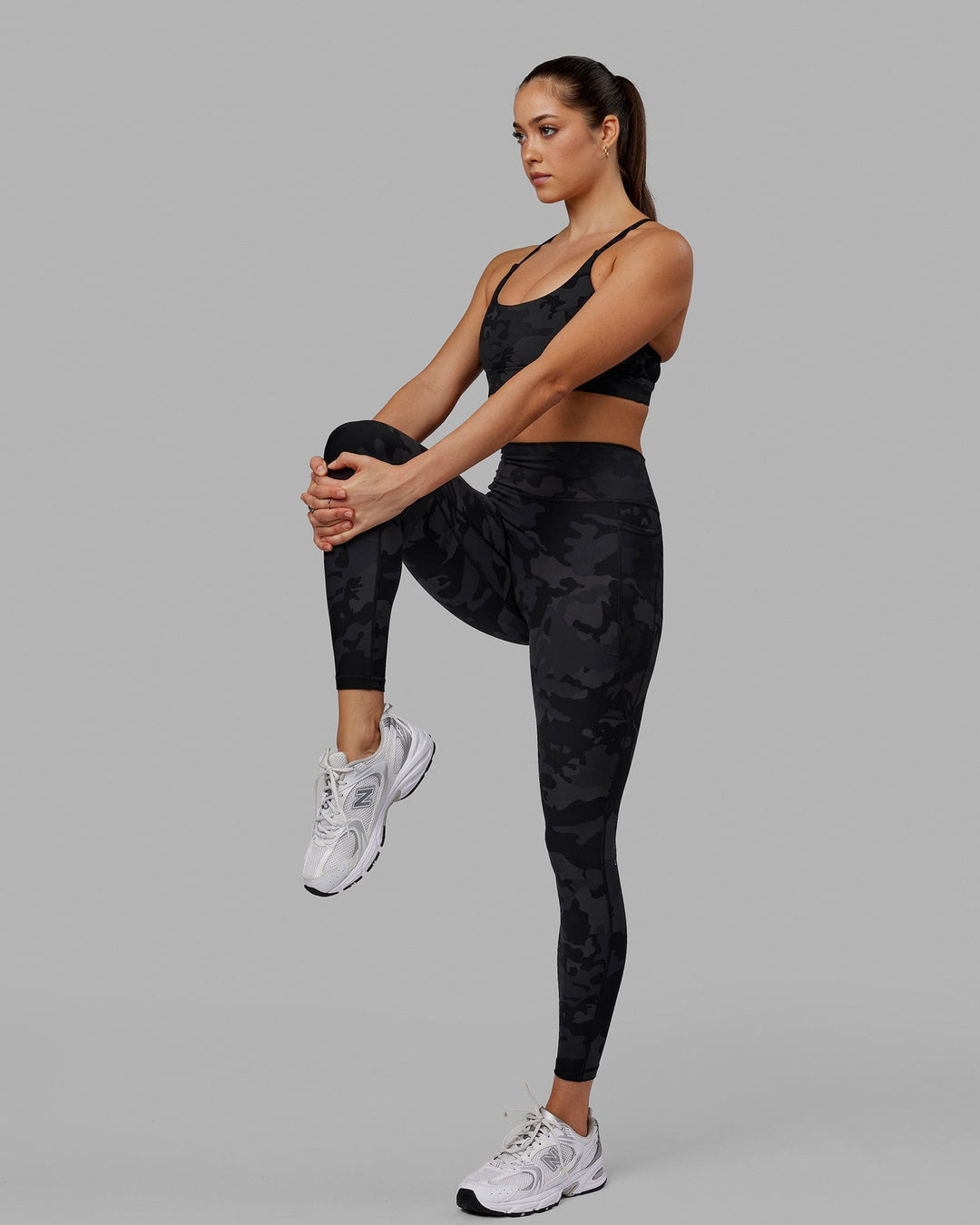 Woman wearing Fusion Ultra High-Rise Full Length Legging Pockets - Black Camo | Model:Katie | Size:S