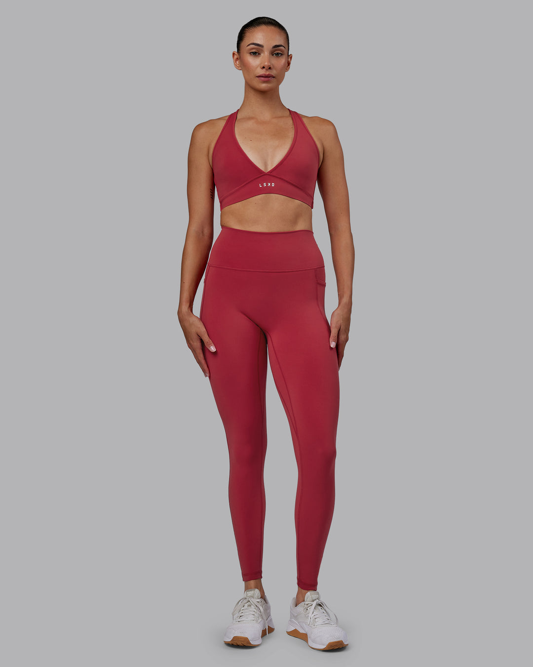 Woman wearing Fusion Ultra High-Rise Full Length Legging Pockets - Claret | Model:Blaize | Size:S