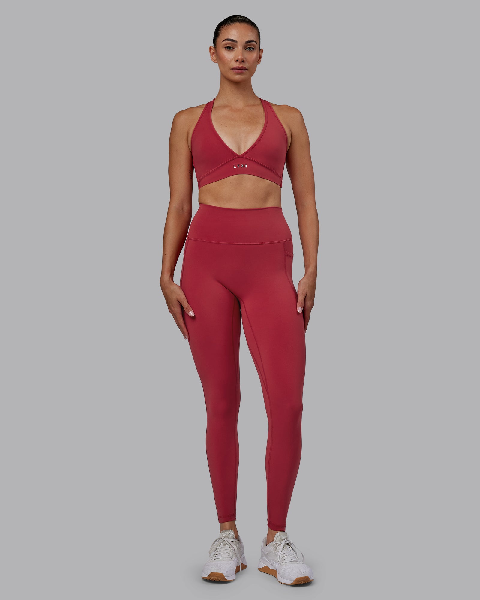 Woman wearing Fusion Ultra High-Rise Full Length Legging Pockets - Claret | Model:Blaize | Size:S