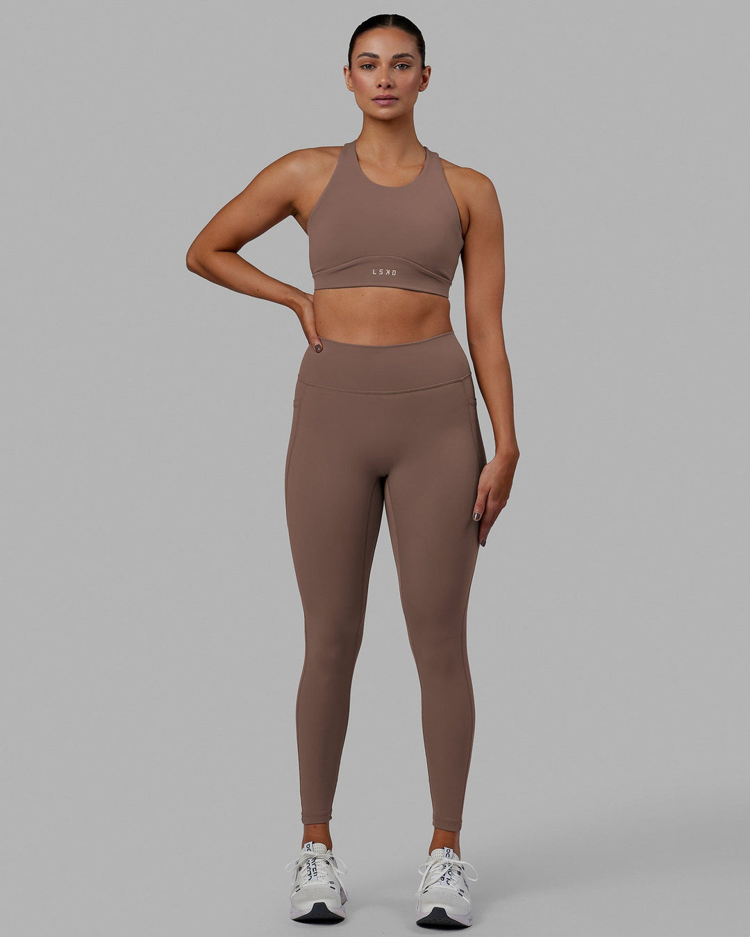 Woman wearing Fusion Ultra High-Rise Full Length Legging Pockets - Deep Taupe | Model:Blaize | Size:S