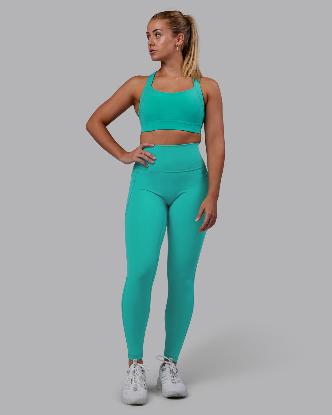 Woman wearing Fusion Ultra High-Rise Full Length Legging Pockets - Turquoise Tide | Model:Hannah | Size:S