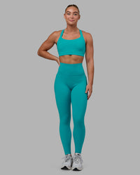 Woman wearing Fusion Ultra High-Rise Full Length Legging Pockets - Uplift Blue | Model:Monique | Size:S