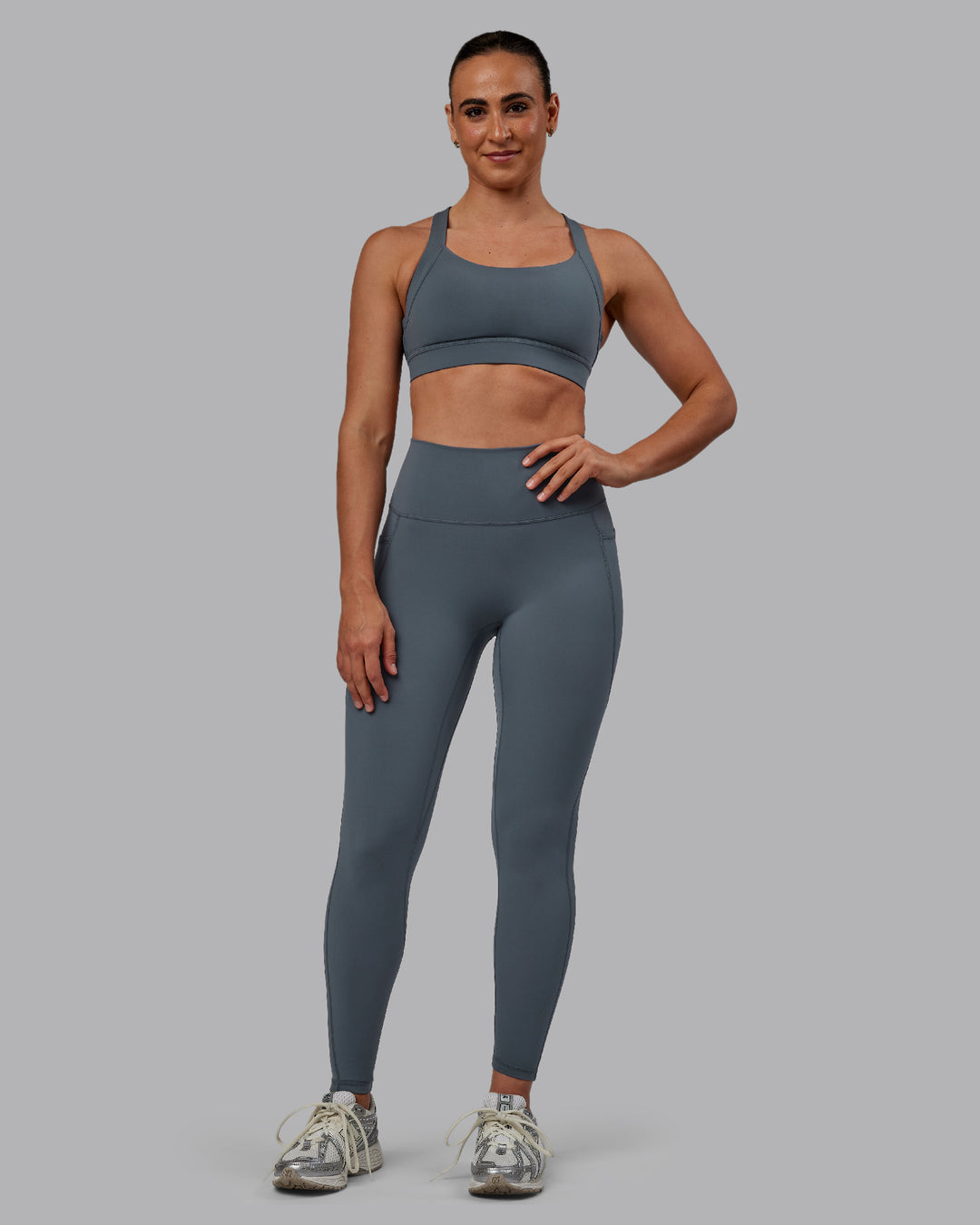Woman wearing Fusion Ultra High-Rise Full Length Legging Pockets - Turbulence | Model:Sophie | Size:S