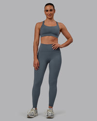 Woman wearing Fusion Ultra High-Rise Full Length Legging Pockets - Turbulence | Model:Sophie | Size:S