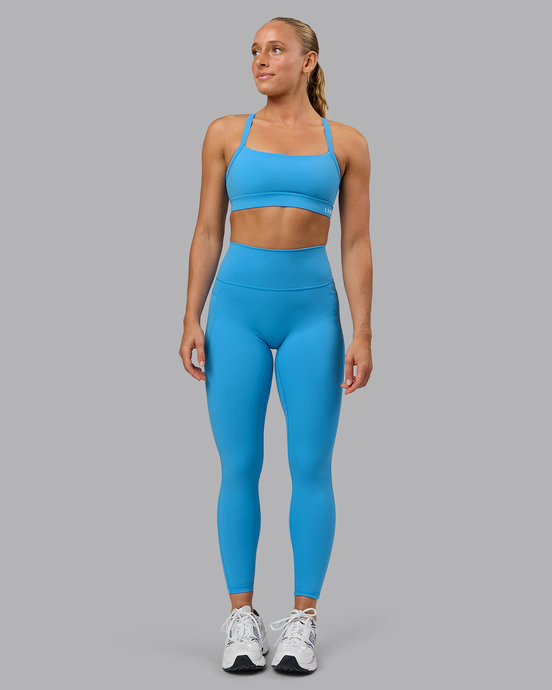 Woman wearing Fusion Ultra High-Rise Full Length Legging Pockets - Azure Blue | Model:Shalem | Size:S