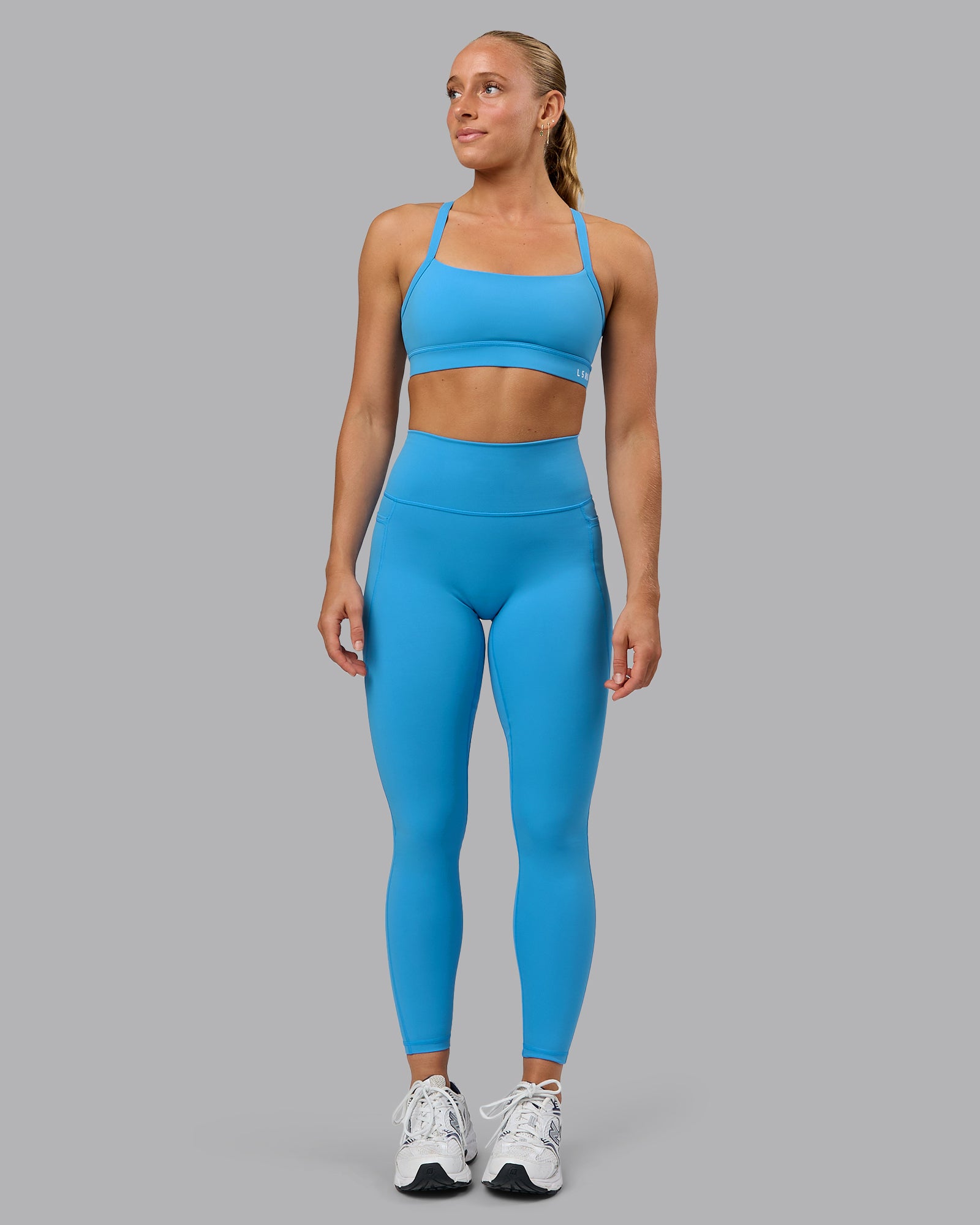 Woman wearing Fusion Ultra High-Rise Full Length Legging Pockets - Azure Blue | Model:Shalem | Size:S