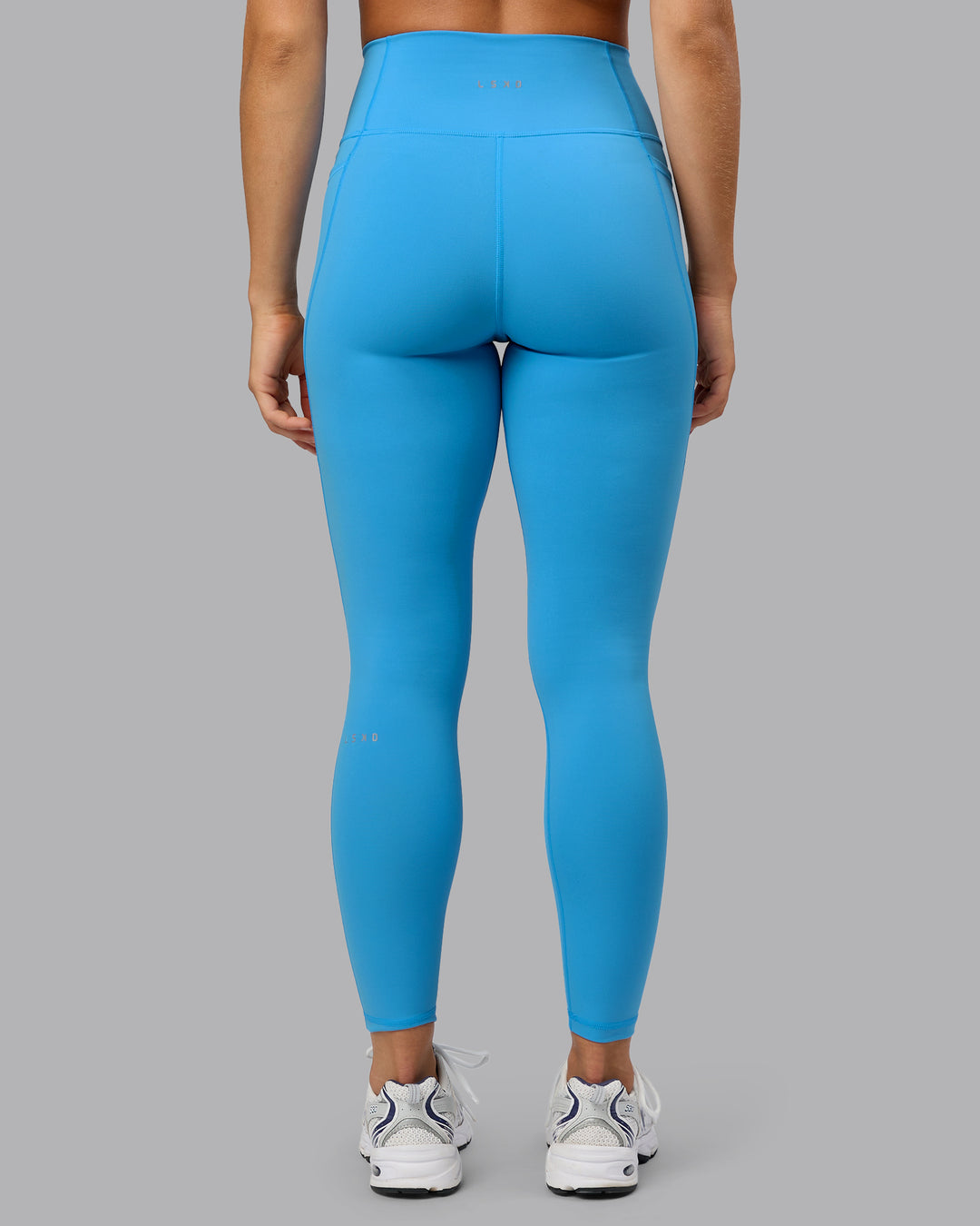 Woman wearing Fusion Ultra High-Rise Full Length Legging Pockets - Azure Blue | Model:Shalem | Size:S