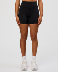 Woman wearing Fusion Graphic Ultra High-Rise 6" Short Pockets - Black-Radiate | Model:Rosie | Size:S