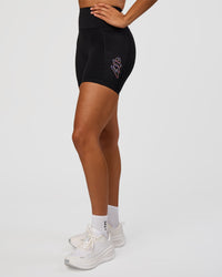 Woman wearing Fusion Graphic Ultra High-Rise 6" Short Pockets - Black-Radiate | Model:Rosie | Size:S