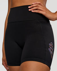 Woman wearing Fusion Graphic Ultra High-Rise 6" Short Pockets - Black-Radiate | Model:Rosie | Size:S