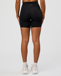 Woman wearing Fusion Graphic Ultra High-Rise 6" Short Pockets - Black-Radiate | Model:Rosie | Size:S