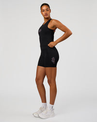 Woman wearing Fusion Graphic Ultra High-Rise 6" Short Pockets - Black-Radiate | Model:Rosie | Size:S