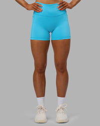 Woman wearing Fusion High-Rise 4" Short Pockets - Blue Atoll | ModelGeorgia | Size:S
