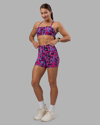 Woman wearing Fusion High-Rise 4" Short Pockets - Pink Luminous | Model:Hannah | Size:S