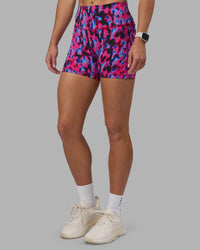 Woman wearing Fusion High-Rise 4" Short Pockets - Pink Luminous | Model:Hannah | Size:S