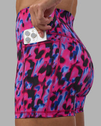 Woman wearing Fusion High-Rise 4" Short Pockets - Pink Luminous | Model:Hannah | Size:S