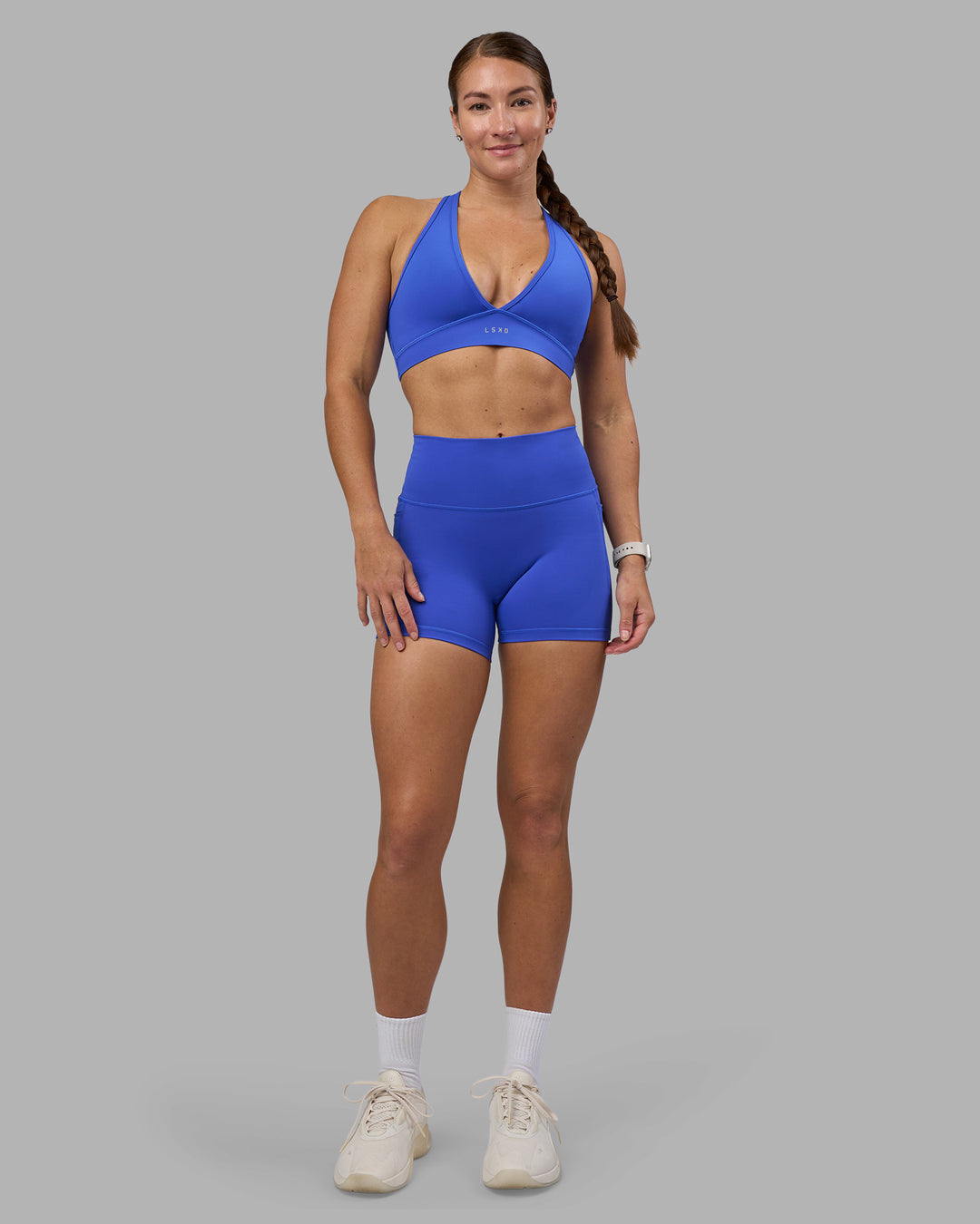 Woman wearing Fusion High-Rise 4&quot; Short Pockets - Power Cobalt | Model:Hannah | Size:S