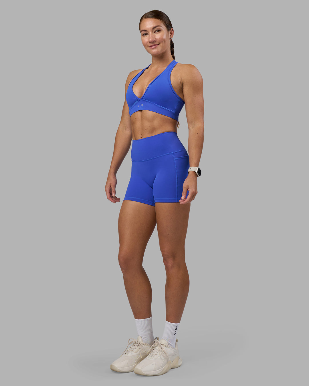 Woman wearing Fusion High-Rise 4&quot; Short Pockets - Power Cobalt | Model:Hannah | Size:S