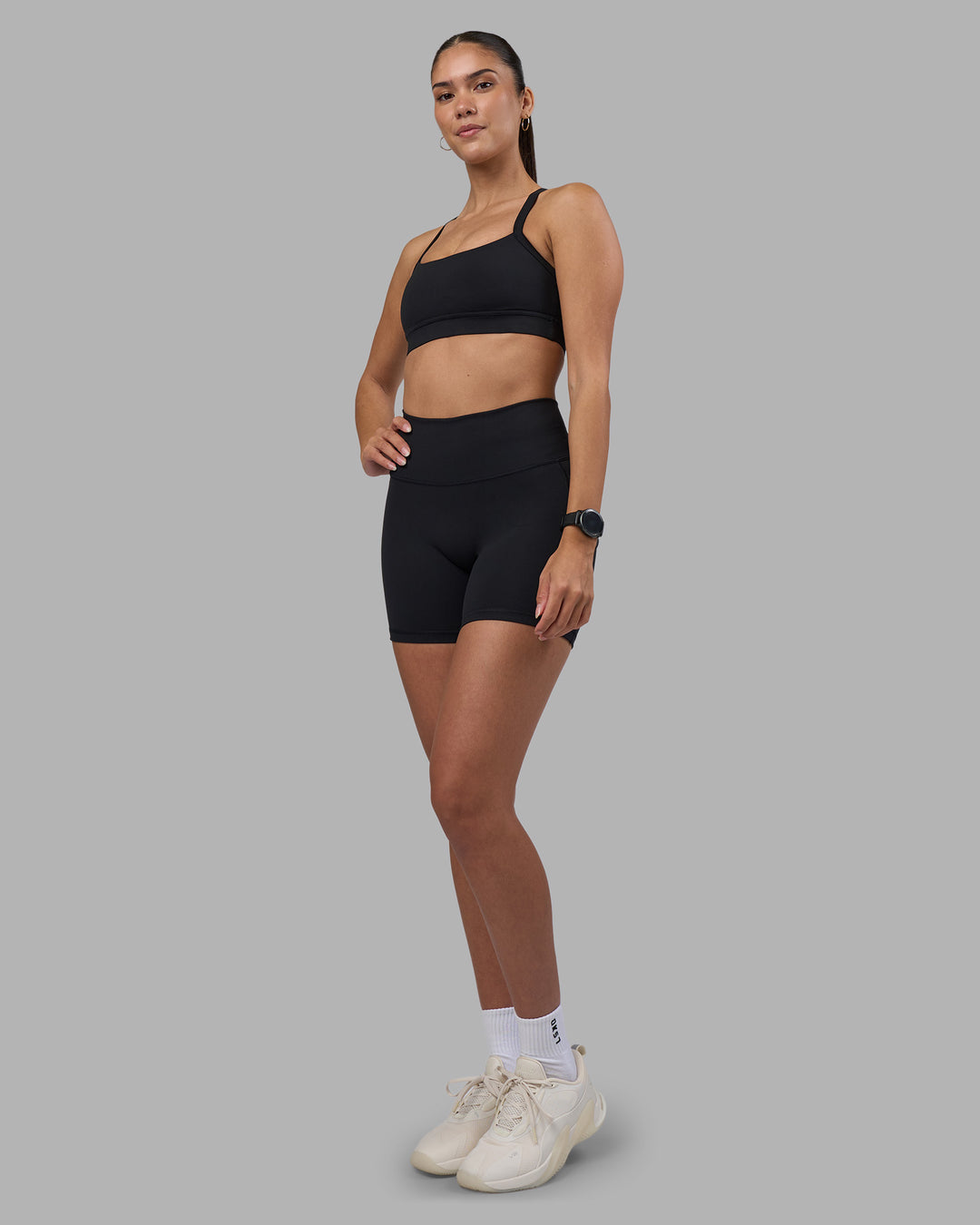 Woman wearing Fusion High-Rise 6&quot; Short Pockets - Black | Model:Rhiley | Size:S
