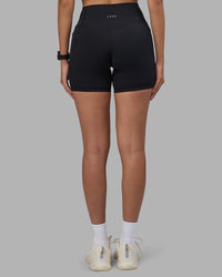 Woman wearing Fusion High-Rise 6" Short Pockets - Black | Model:Rhiley | Size:S