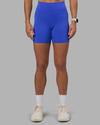 Woman wearing Fusion High-Rise 6" Short Pockets - Power Cobalt | Model:Hannah | Size:S