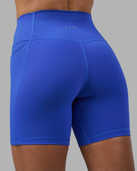Woman wearing Fusion High-Rise 6" Short Pockets - Power Cobalt | Model:Hannah | Size:S