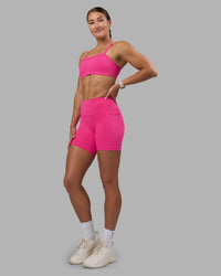 Woman wearing Fusion High-Rise 6" Short Pockets - Ultra Pink | Model:Hannah | Size:S