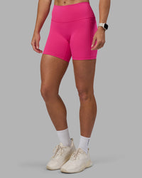 Woman wearing Fusion High-Rise 6" Short Pockets - Ultra Pink | Model:Hannah | Size:S