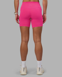 Woman wearing Fusion High-Rise 6" Short Pockets - Ultra Pink | Model:Hannah | Size:S