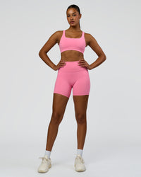 Woman wearing Fusion High-Rise 6" Short Pockets - Candy Pink | Model:Rosie | Size:S