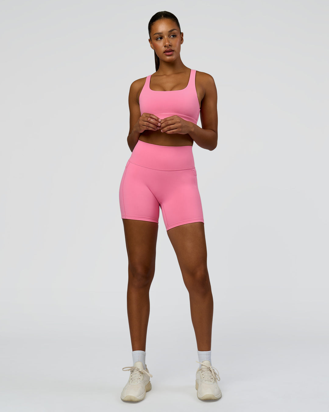 Woman wearing Fusion High-Rise 6" Short Pockets - Candy Pink | Model:Rosie | Size:S