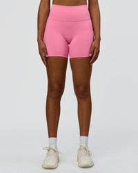 Woman wearing Fusion High-Rise 6" Short Pockets - Candy Pink | Model:Rosie | Size:S