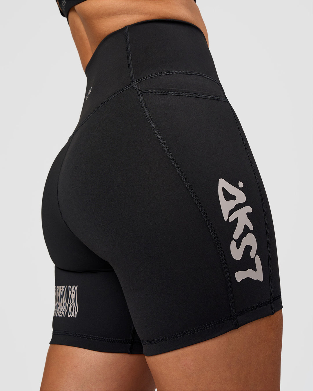 Woman wearing Fusion Hype Graphic Ultra High-Rise 6" Short Pockets - Black-Alloy | Model:Rhiley | Size:S