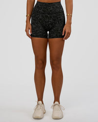 Woman wearing Fusion Icon Ultra High-Rise 4" Short Pockets - Energy Print Black | Model:Amity | Size:S