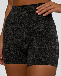 Woman wearing Fusion Icon Ultra High-Rise 4" Short Pockets - Energy Print Black | Model:Amity | Size:S