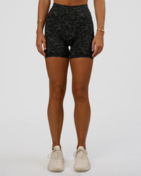 Woman wearing Fusion Icon Ultra High-Rise 6" Short Pockets - Energy Print Black | Model:Amity | Size:S