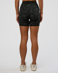 Woman wearing Fusion Icon Ultra High-Rise 6" Short Pockets - Energy Print Black | Model:Amity | Size:S