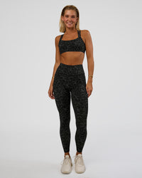 Woman wearing Fusion Icon Ultra High-Rise Full Length Legging Pockets - Energy Print Black-Reflective | Model:Amity | Size:S