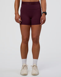 Woman wearing Fusion Jacquard High-Rise 4” Short Pockets - Cherry Lacquer | Model:Sav | Size:S