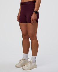 Woman wearing Fusion Jacquard High-Rise 4” Short Pockets - Cherry Lacquer | Model:Sav | Size:S