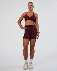 Woman wearing Fusion Jacquard High-Rise 6" Short Pockets - Cherry Lacquer | Model:Sav | Size:S