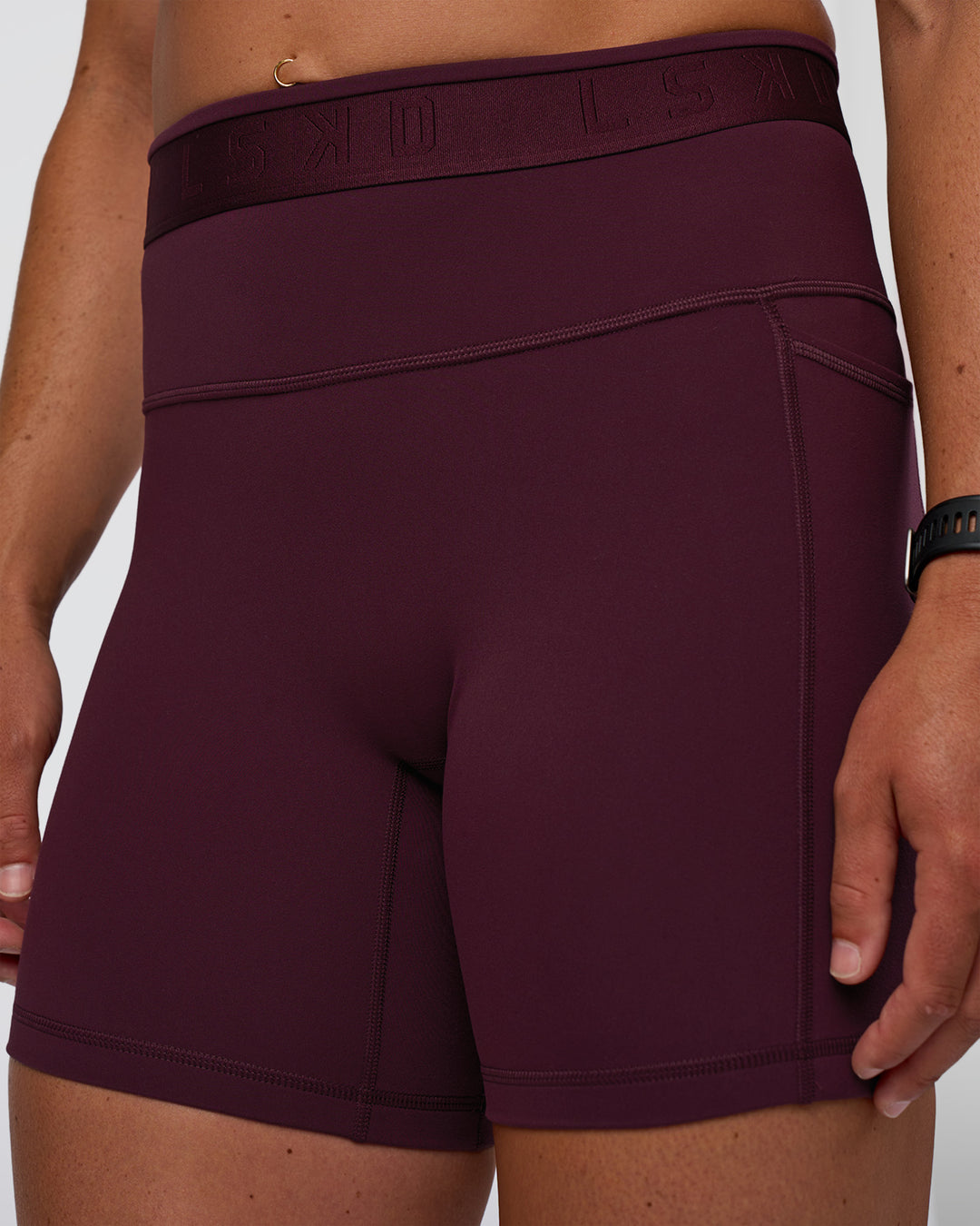 Woman wearing Fusion Jacquard High-Rise 6&quot; Short Pockets - Cherry Lacquer | Model:Sav | Size:S