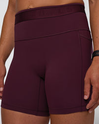Woman wearing Fusion Jacquard High-Rise 6" Short Pockets - Cherry Lacquer | Model:Sav | Size:S