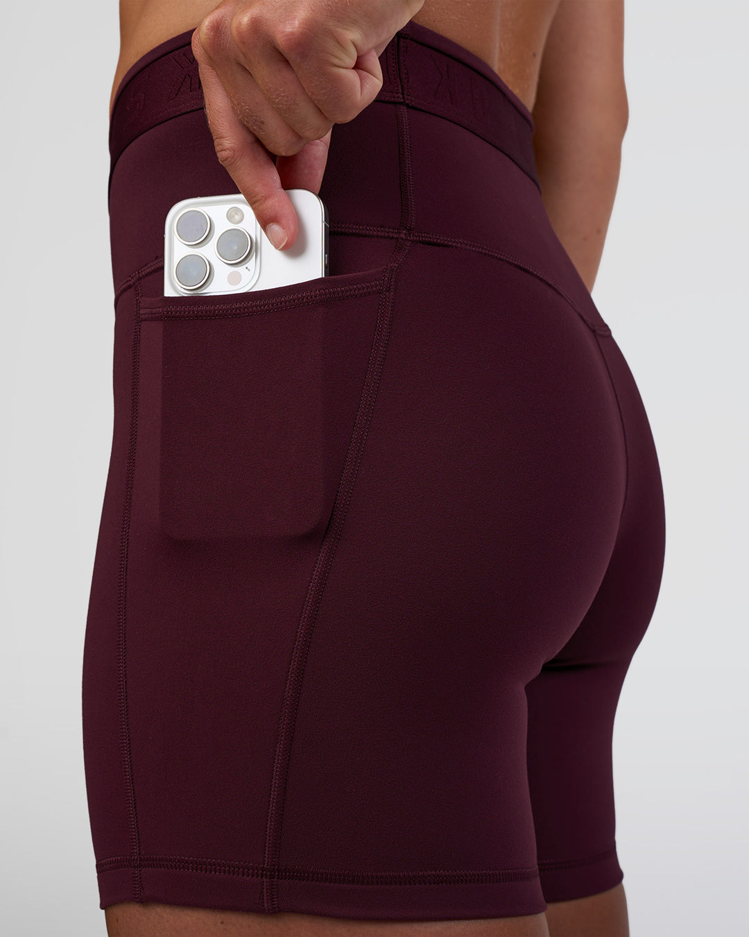 Woman wearing Fusion Jacquard High-Rise 6&quot; Short Pockets - Cherry Lacquer | Model:Sav | Size:S