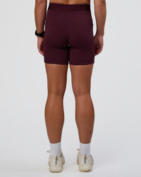 Woman wearing Fusion Jacquard High-Rise 6" Short Pockets - Cherry Lacquer | Model:Sav | Size:S