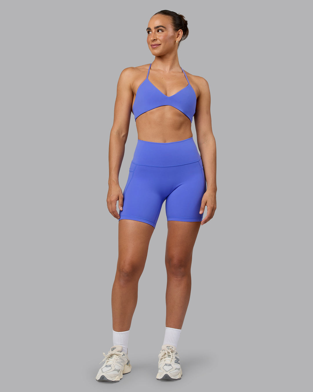 Woman wearing Fusion Ultra High-Rise 6&quot; Short Pockets - Baja Blue | Model:Sophie | Size:S