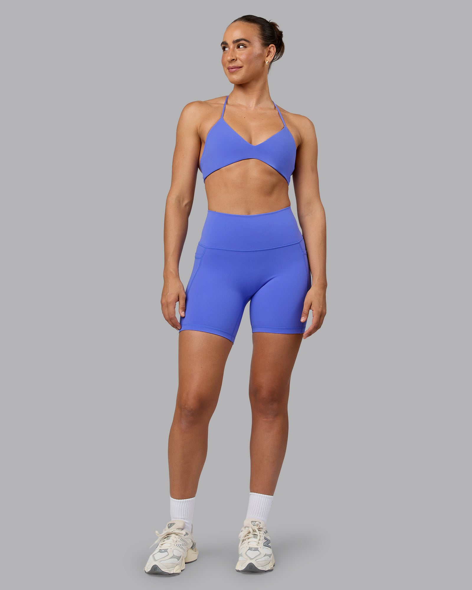 Woman wearing Fusion Ultra High-Rise 6" Short Pockets - Baja Blue | Model:Sophie | Size:S