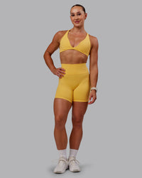 Woman wearing Fusion Ultra High-Rise 6" Short - Banana Cream | Model:Amber | Size:S