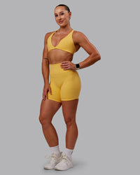 Woman wearing Fusion Ultra High-Rise 6" Short - Banana Cream | Model:Amber | Size:S