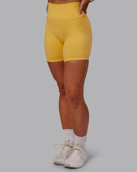 Woman wearing Fusion Ultra High-Rise 6" Short - Banana Cream | Model:Amber | Size:S